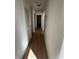 Light and airy hallway with light wood-look flooring at 1777 Cahoon Sw St, Atlanta, GA 30310
