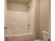 Bathroom with shower/tub combo and neutral tile flooring at 138 Gorham Gates Dr, Hiram, GA 30141