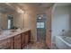 Double vanity bathroom with a view into a bedroom at 138 Gorham Gates Dr, Hiram, GA 30141