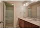 Bathroom with double vanity, mirror, and shower/tub combo at 138 Gorham Gates Dr, Hiram, GA 30141