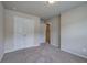 Bedroom with double closet doors and access to a hallway at 138 Gorham Gates Dr, Hiram, GA 30141