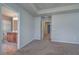 Well-lit bedroom with carpeted floor and access to hallway at 138 Gorham Gates Dr, Hiram, GA 30141