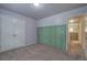 Bedroom with carpet, double doors, and access to a hallway at 138 Gorham Gates Dr, Hiram, GA 30141