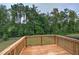 Wooden deck overlooking a fenced backyard and wooded area at 138 Gorham Gates Dr, Hiram, GA 30141