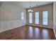 Dining room with hardwood floors, wainscoting, and a chandelier at 138 Gorham Gates Dr, Hiram, GA 30141