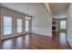 Formal dining area with hardwood floors, wainscoting, and three windows at 138 Gorham Gates Dr, Hiram, GA 30141