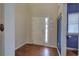 Front entry with hardwood floor, white door and a blue accent wall at 138 Gorham Gates Dr, Hiram, GA 30141