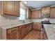 Kitchen boasts granite countertops and stainless steel appliances at 138 Gorham Gates Dr, Hiram, GA 30141