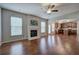 Open living room with hardwood floors, fireplace, and kitchen views at 138 Gorham Gates Dr, Hiram, GA 30141