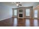 Spacious living room with hardwood floors, fireplace, and ceiling fan at 138 Gorham Gates Dr, Hiram, GA 30141