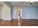 Open living area with hardwood floors and access to other rooms at 138 Gorham Gates Dr, Hiram, GA 30141