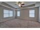 Large main bedroom with carpeted floors and ceiling fan at 138 Gorham Gates Dr, Hiram, GA 30141