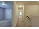 Upstairs hallway with carpet and doors to bedrooms at 138 Gorham Gates Dr, Hiram, GA 30141