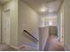 Upstairs hallway with carpet, neutral walls, and access to bedrooms at 138 Gorham Gates Dr, Hiram, GA 30141