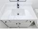 White bathroom vanity with marble countertop and black hardware at 7351 Poppy Way, Union City, GA 30291