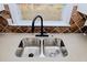 Modern kitchen sink with black faucet and granite countertop at 7351 Poppy Way, Union City, GA 30291