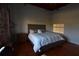 Bedroom with hardwood floors and exposed brick wall at 490 Marietta St # 307, Atlanta, GA 30313