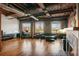 Spacious living area with exposed brick, hardwood floors, and a fireplace at 490 Marietta St # 307, Atlanta, GA 30313