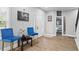 Bright entryway with blue chairs and a view into another room at 1174 Princess Sw Ave, Atlanta, GA 30310