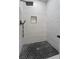 Clean shower with black hexagonal floor tiles at 1174 Princess Sw Ave, Atlanta, GA 30310