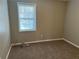 Simple bedroom with carpeted floor and window at 3506 Ten Oaks Ct, Powder Springs, GA 30127