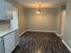 Dining area with light gray walls and wood-look floors at 3506 Ten Oaks Ct, Powder Springs, GA 30127