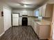 Galley kitchen features ample cabinet space and a pantry at 3506 Ten Oaks Ct, Powder Springs, GA 30127