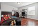 Spacious bedroom with a gaming setup and wood floors at 2599 Windsor Knoll Dr, Dacula, GA 30019