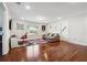 Versatile bonus room with hardwood floors and a comfortable seating area at 2599 Windsor Knoll Dr, Dacula, GA 30019