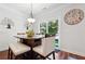 Bright dining area with sliding glass doors leading to the backyard at 2599 Windsor Knoll Dr, Dacula, GA 30019