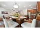 Open concept dining area with kitchen and living room access at 2599 Windsor Knoll Dr, Dacula, GA 30019