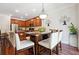 Dining area with seating for six and kitchen views at 2599 Windsor Knoll Dr, Dacula, GA 30019