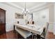 Bright dining room with hardwood floors, chandelier, and built-in hutch at 2599 Windsor Knoll Dr, Dacula, GA 30019
