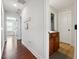 Clean hallway with wood floors and access to bedrooms at 2599 Windsor Knoll Dr, Dacula, GA 30019