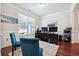 Home office with hardwood floors, two monitors, and ample natural light at 2599 Windsor Knoll Dr, Dacula, GA 30019