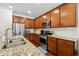 Modern kitchen featuring stainless steel appliances and granite countertops at 2599 Windsor Knoll Dr, Dacula, GA 30019