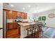 Modern kitchen with granite countertops, stainless steel appliances, and an island at 2599 Windsor Knoll Dr, Dacula, GA 30019