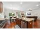Island kitchen with granite countertops, stainless steel appliances, and breakfast bar at 2599 Windsor Knoll Dr, Dacula, GA 30019