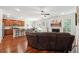 Open concept living space featuring hardwood floors, a fireplace, and ample natural light at 2599 Windsor Knoll Dr, Dacula, GA 30019