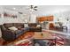 Open living area with hardwood floors, sectional sofa, and kitchen island view at 2599 Windsor Knoll Dr, Dacula, GA 30019