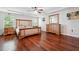 Large main bedroom with hardwood floors and a ceiling fan at 2599 Windsor Knoll Dr, Dacula, GA 30019