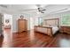 Spacious main bedroom with wood floors and an ensuite bathroom at 2599 Windsor Knoll Dr, Dacula, GA 30019