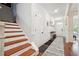Elegant staircase with white risers and rich wood treads at 2599 Windsor Knoll Dr, Dacula, GA 30019