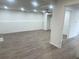 Finished basement with hardwood floors and a ceiling fan at 1445 Watercrest Cir, Lawrenceville, GA 30043