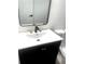 Stylish bathroom with a modern vanity and mirror at 1445 Watercrest Cir, Lawrenceville, GA 30043