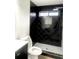 Clean bathroom with black and white tile shower at 1445 Watercrest Cir, Lawrenceville, GA 30043