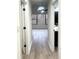 Hallway leading to bedrooms with updated flooring at 1445 Watercrest Cir, Lawrenceville, GA 30043