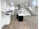 Contemporary kitchen featuring white cabinets and a spacious island at 1445 Watercrest Cir, Lawrenceville, GA 30043