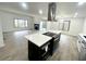 Open concept kitchen with island and stainless steel appliances at 1445 Watercrest Cir, Lawrenceville, GA 30043