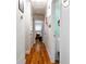 Bright hallway with hardwood floors and doors to bedrooms at 118 Lucia Se Dr, Smyrna, GA 30082